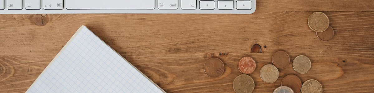 Business finance FAQ — keyboard and coins